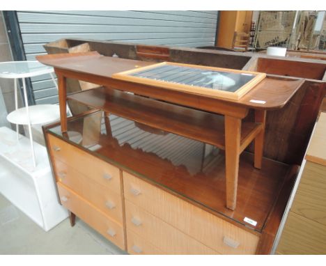A vintage teak style coffee table with solid undertier