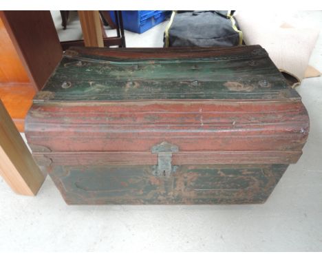 A vintage tin travel trunk
