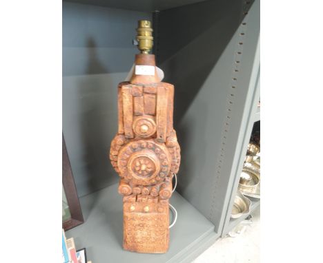 A tall standing table lamp by Bernard Rooke with an Aztec design