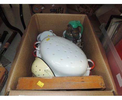 A selection of kitchen wares including enamel cooking pots