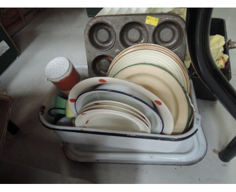 A selection of vintage kitchen wares including enamel wares