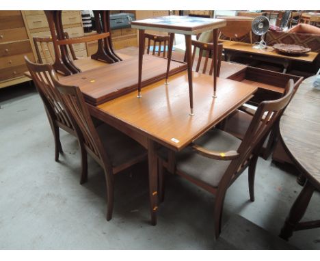 A vintage teak G plan extending dining table and set of six (four plus two) dining chairs