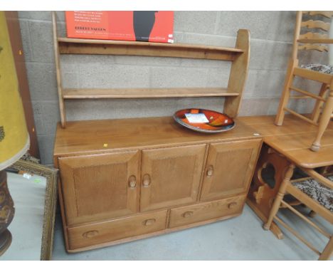 An Ercol style side board with plate rackApprox 30.5 h x 51" W x 17" D