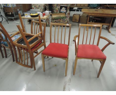 A set of four light oak dining chairs