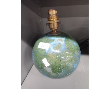 A heavy set ceramic lamp base in the design of planet earth
