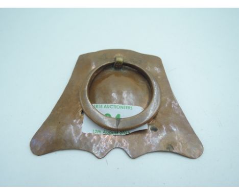 An arts and crafts design copper door knocker 