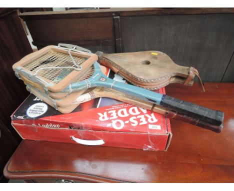 A Res-Q-Ladder. A set of bellows and two framed tennis rackets