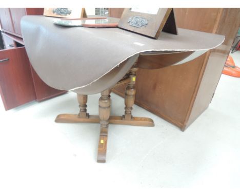 A 1990s Ercol old colonial style drop leaf table