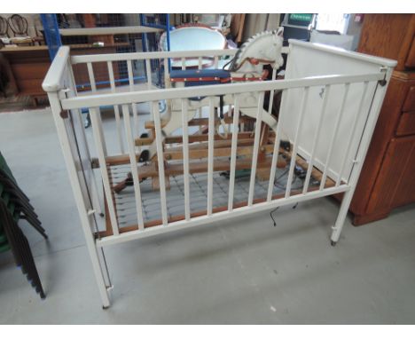 A vintage wooden cot