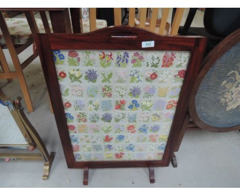 A wood frame firescreen with quilted panel