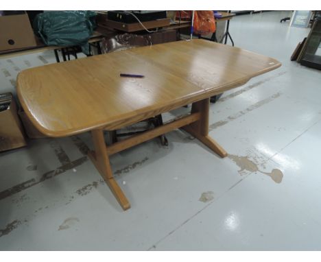 A modern Ercol light stain dining table