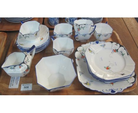 Tray of Shelley bone china, Art Deco design teaware on a white ground with floral enamel decoration.  Registration number: 72