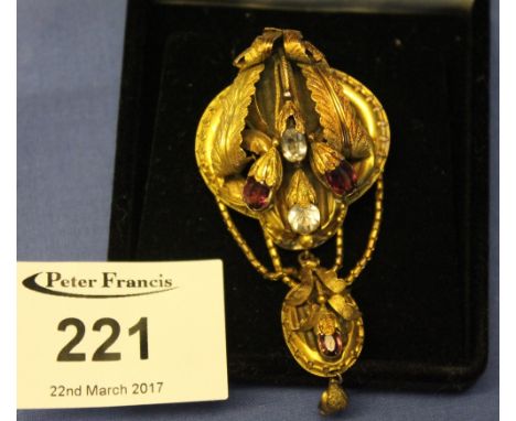 Gilt metal, gem set leaf and flower design bar brooch/pendant in associated box.   CONDITION REPORT:  Item is mis-shapen and 