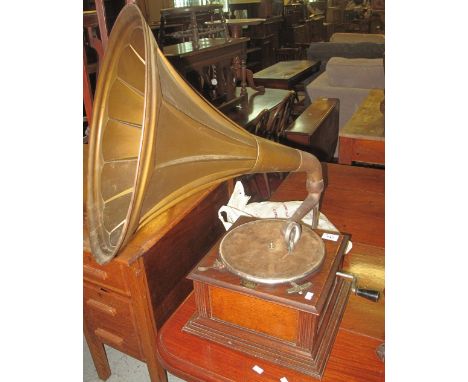 Vintage Apollo London gramophone with metal horn and a small collection of records.