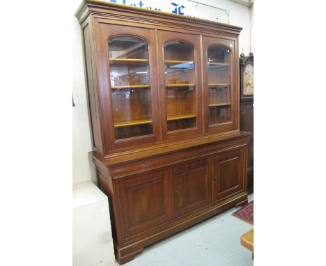 Large modern hardwood two stage display cabinet on bracket feet.   CONDITION REPORT:  Interior has adjustable shelves - a goo
