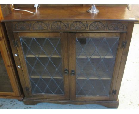 Mid 20th Century oak astragal glazed display cabinet on bracket feet.