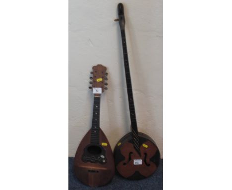 Italian eight string mandolin with mother-of-pearl inlaid, tortoiseshell finger board, together with a single string, banjo t