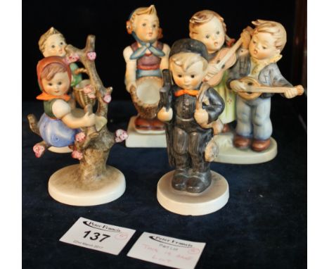 Five Goebel Hummel West German figures and figure group to include: children with basket; children musicians etc. (5)