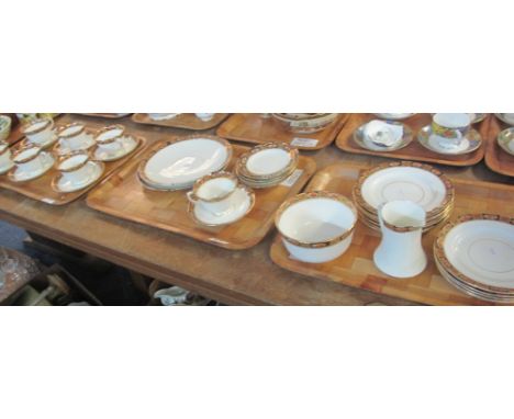 Three trays of Royal Albert Crown china teaware comprising: teacups and saucers; various plates; milk jug and sucrier. (3)