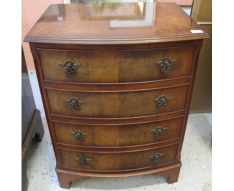 Reproduction walnut bow front narrow chest of four long drawers on bracket feet.