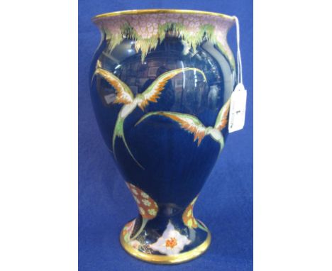 Carlton ware pottery baluster shaped vase, decorated with birds and trees, on a dark blue ground with over-gilding.  Printed 