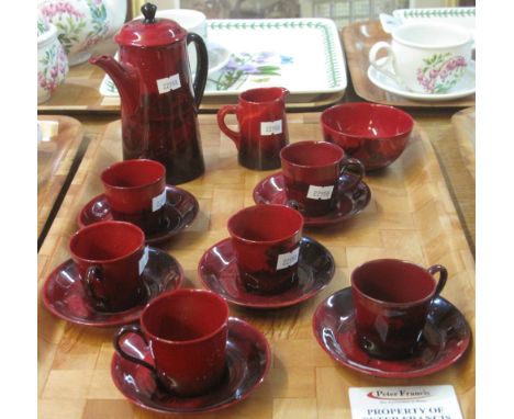 Royal Doulton flambé coffee set comprising: six coffee cups and saucers; coffee pot; milk jug and sucrier.