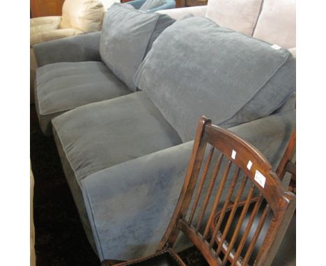 Modern blue upholstered large two seater sofa.