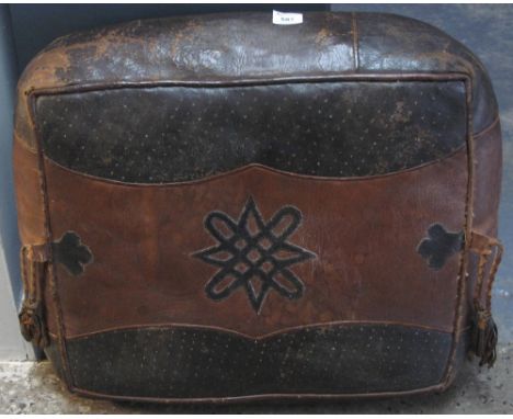 Leather two-tone geometric pouffe.   CONDITION REPORT:  Scuffed and worn, particularly to corners.  One hole noted.22" x 25".