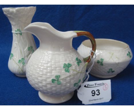 Belleek porcelain cane work, shamrock decorated cream jug and sucrier, together with a Belleek porcelain posy vase.  Printed 