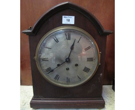 Early 20th Century oak lancet shaped, three train mantel clock with Roman numerals and German movement.