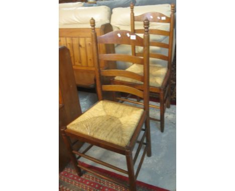 Pair of 20th Century oak, ladder back kitchen chairs with rush seats. (2)