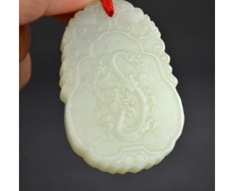 Chinese Carved Celadon Jade Dragon Pendant Chinese celadon jade pendant carved with a dragon  on one side, fruit on the other