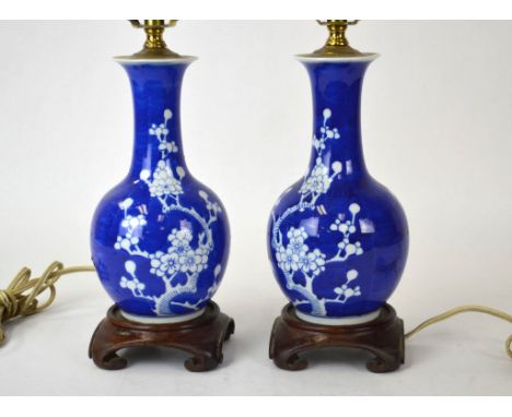 Pr Chinese Blue & White Porcelain Vases as Lamps Pair of Chinese porcelain lamp bases decorated  with white branches of cherr