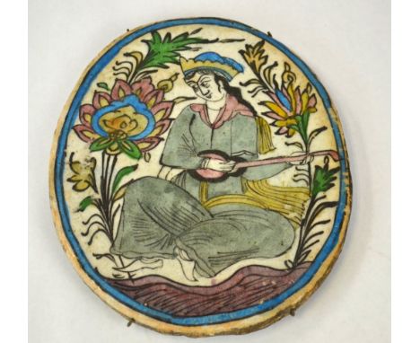 Persian Painted Ceramic Tile Persian ceramic tile painted with seated figure  playing instrument. 10 1/4" x 8 1/4" x 1/2"