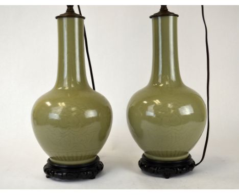 Pr Chinese Celadon Bottle Vases Lamp Pair of Chinese porcelain vases fitted as lamp  bases, both covered in a celadon glaze. 