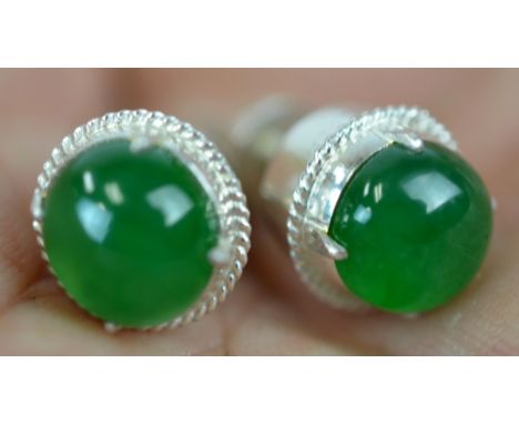 Pair of Chinese Natural Green Jadeite Earrings Pair of Chinese green jadeite earrings set in  silver. Guaranteed 100% natural