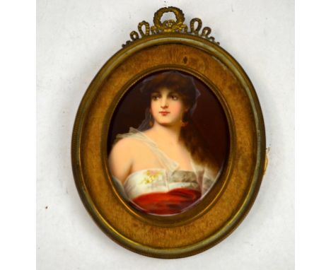 Framed Porcelain Plaque with Portrait Porcelain plaque painted with woman in red and  white dress, most likely European. Comp