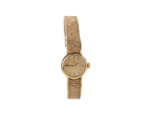 LADY'S OMEGA NINE CARAT GOLD MANUAL WIND WRIST WATCH, the round champagne dial with applied hour markers, 16mm case with pers
