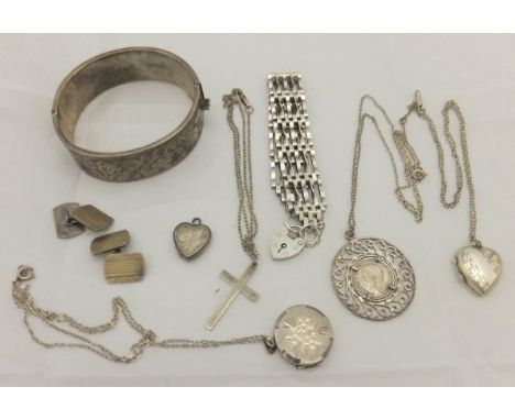 A collection of silver and other white metal jewellery including bracelet, bangle, lockets, etc