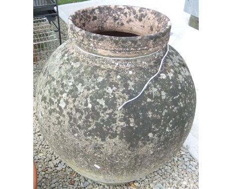 A large vintage terracotta olive jar