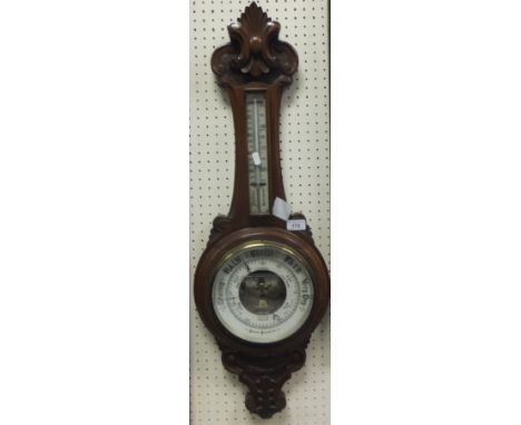 A late Victorian walnut cased aneroid barometer / thermometer by J Siddall Optician Chester