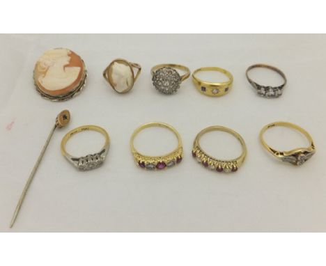 A collection of eight various dress rings, to include cameo set ring, white stone and ruby set rings, together with a cameo b