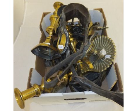 A box containing various brass candlesticks, trivets, martingales, etc CONDITION REPORTS Martingales with wear and some deter