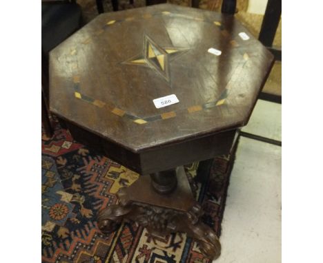 A mahogany and inlaid octagonal work table on associated barley-twist pedestal to carved tripod base in the Rococo style
