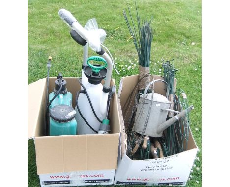 A box containing three garden sprayers, a box containing wooden handled gardening tools, galvanised watering can and garden s