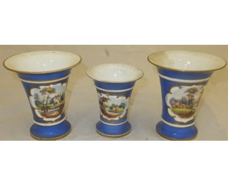 A set of three 19th Century English porcelain trumpet shaped vases, each with landscape panel decoration and bearing Design N