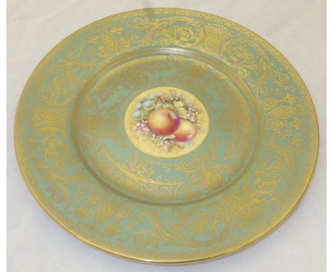 A Royal Worcester cabinet plate painted with fruit by T Nutt on a celadon and gilt decorated ground, signed 