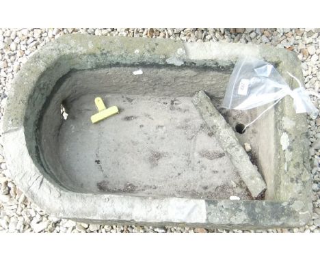 A natural stone D-end trough