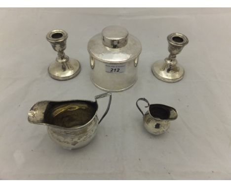 A late Victorian silver cream jug (Birmingham, 1891) with engraved scrolling decoration, together with a pair of modern silve