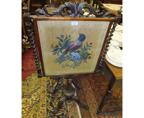 A Victorian rosewood pole screen, the beadwork panel with exotic bird amongst blossom, flanked by barley-twist supports, rais